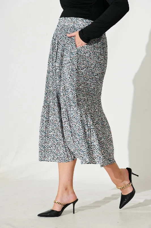 pretty-woman-pleat-skirt-in-black-with-beige-ditsy-floral